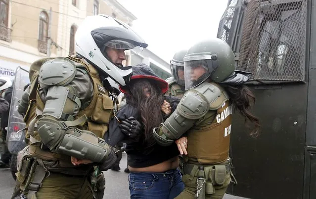 A student is detained by riot police during a protest against the government to demand changes and end to the profiteering in the education system, in Valparaiso,  May 14, 2015. (Photo by Rodrigo Garrido/Reuters)