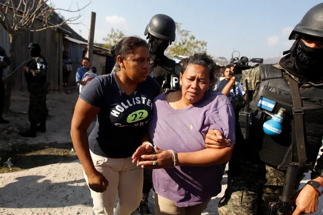 Members of the Military Police for Public Order (PMOP) arrested a woman as they search people for drugs and weapons during a patrol in the impoverished Villa Campesina neighbourhood in Tegucigalpa, Honduras February 24, 2017. (Photo by Jorge Cabrera/Reuters)