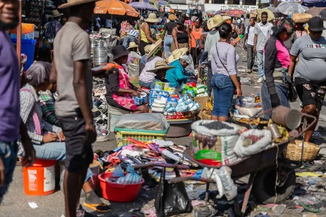 Merchants seated to sell food products in the Petion-ville street market, amid the ongoing insecurity and political instability in Port-au-Prince, Haiti, March 21, 2024. (Photo by Guerinault Louis/Anadolu via Getty Images)