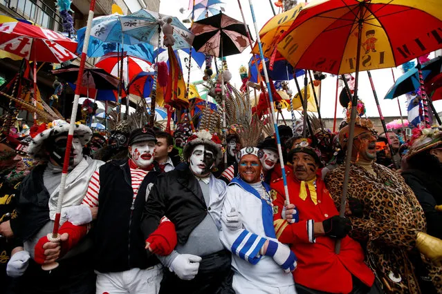 People wear local carnival costumes during the parade of “Carnaval de Dunkerque” in Dunkirk, France  February 26, 2017. (Photo by Pascal Rossignol/Reuters)