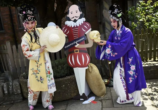 Chinese performers pose for a friend (out of frame) to take picture outside the house where William Shakespeare was born during celebrations to mark the 400th anniversary of the playwright's death in  Stratford-Upon-Avon, Britain, April 23, 2016. (Photo by Dylan Martinez/Reuters)