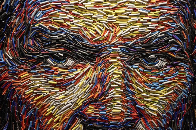 A portrait made with waste materials such as old uniforms, buttons, plastic boxes and bags collected at Istanbul Airport by artist Deniz Sagdic are being displayed at Istanbul Airport's International Departures in Istanbul, Turkey on January 12, 2022. (Photo by Onur Coban/Anadolu Agency via Getty Images)