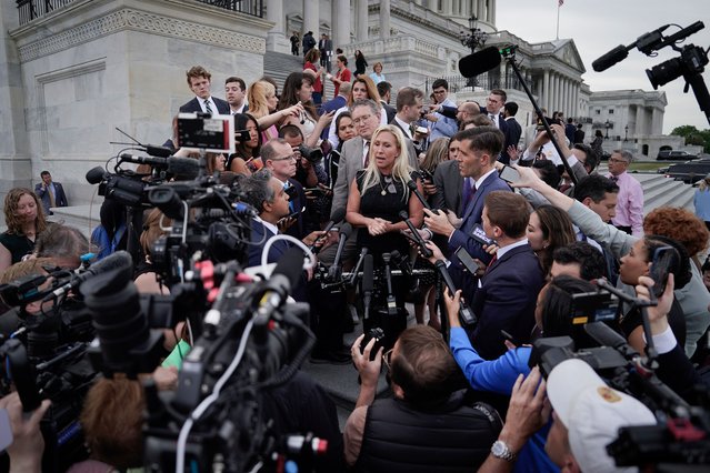 Rep. Marjorie Taylor Greene (R-GA), and Rep. Thomas Massie (R-KY), speak to members of the press while exiting the U.S. Capitol after introducing a motion to vacate on the floor of the House of Representatives seeking to remove Speaker of the House Mike Johnson (R-LA) from his leadership position May 8, 2024 in Washington, DC. The House voted 359 to 43 to table the motion to vacate. (Photo by Kent Nishimura/Getty Images)