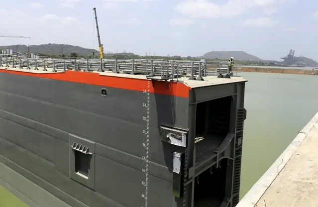 An engineer carries out an inspection of the floodgates during a visit to view the new set of locks of the Panama Canal Expansion Project on the Pacific side of the Panama Canal on the outskirts of Panama City July 3, 2015. According to the authorities of the Grupos Unidos por el Canal (GUPC), the contractor for the project, the floodgates of the new set of locks on both the Atlantic and Pacific sides of the canal are still being electromechanically tested, and are expected to be operational in 2016. (Photo by Carlos Jasso/Reuters)