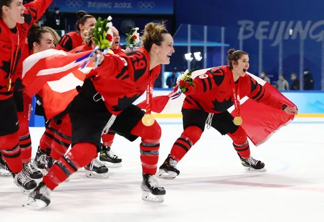 Gold medal winners Marie-Philip Poulin #29, Jamie Lee Rattray #47 and their Team Canada teammates celebrate after the Women's Ice Hockey Gold Medal match between Team Canada and Team United States on Day 13 of the Beijing 2022 Winter Olympic Games at Wukesong Sports Centre on February 17, 2022 in Beijing, China. (Photo by Elsa/Getty Images)