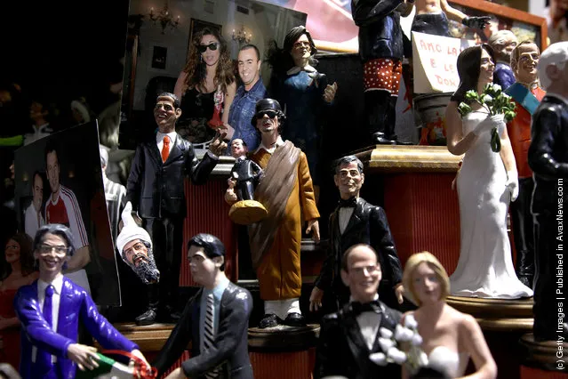 Figurines featuring famous people are shown outside 'Di Virgilio' store at Via San Gregorio Armeno