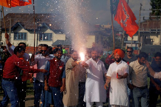 Supporters of India's Bharatiya Janata Party (BJP) light fireworks to celebrate after learning the initial general election results, in Srinagar on June 4, 2024. (Photo by Sharafat Ali/Reuters)