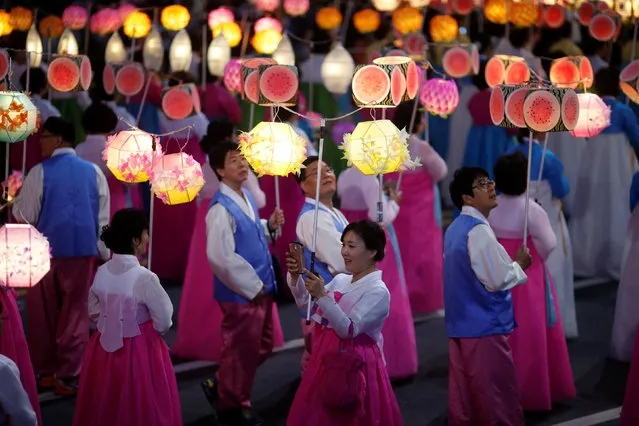 A Buddhist takes a selfie as they march with lanterns during a lotus lantern parade in celebration of the upcoming birthday of Buddha in Seoul, South Korea, May 7, 2016. (Photo by Kim Hong-Ji/Reuters)