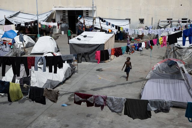 A camp at the Gymnasium Vincent sports center, in Port-au-Prince, Haiti, 02 June 2024 Just behind the National Palace of Haiti, 1,125 people, half of them minors, live in poverty in the Gymnasium Vincent, an improvised shelter for 225 families who have fled their homes due to the violence. (Photo by Orlando Barria/EPA)