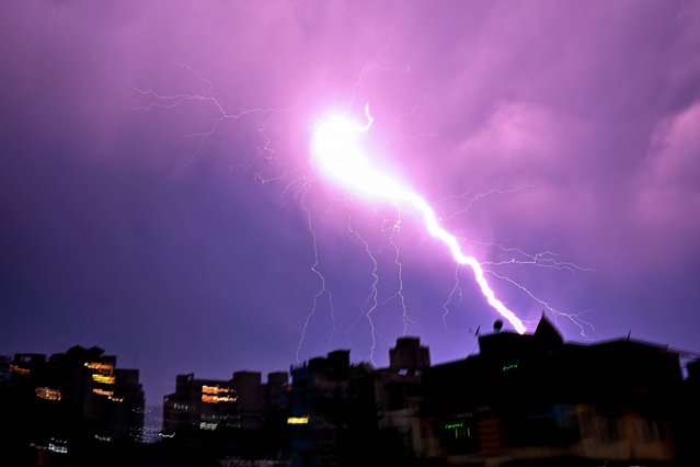 Lightning illuminates the night sky during a storm in Guwahati on March 31, 2024. (Photo by Biju Boro/AFP Photo)