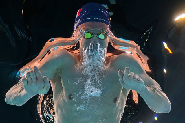 An underwater view shows France's Leon Marchand competing in the final of the men's 400m individual medley swimming event during the Paris 2024 Olympic Games at the Paris La Defense Arena in Nanterre, west of Paris, on July 28, 2024. (Photo by François-Xavier Marit/AFP Photo)