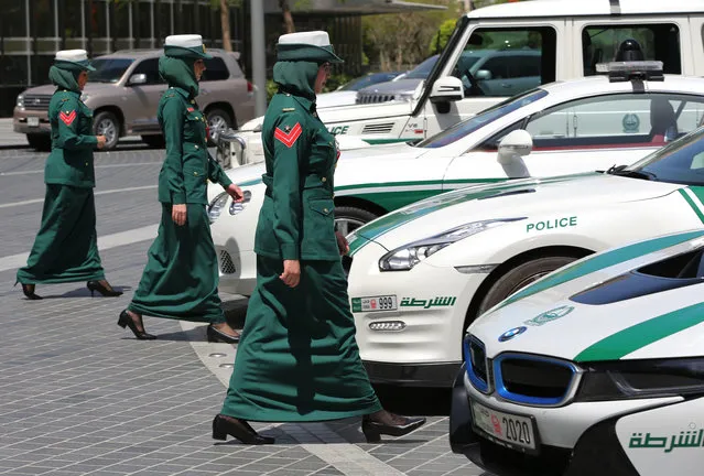 In this Thursday May 19, 2016 photo, Dubai police women walk towards their luxury cars during a demonstration in Dubai, United Arab Emirates. (Photo by Kamran Jebreili/AP Photo)