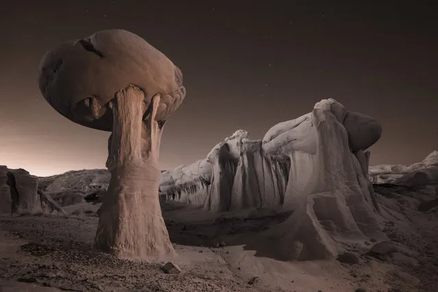 An infrared image at dusk of strange clay rock formations in Ah-Shi-Sle-Pah Wilderness in Farmington, New Mexico. (Photo by David Clapp/Barcroft Images)