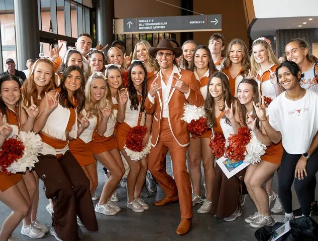 University of Texas Minister of Culture, actor Matthew McConaughey, poses with cheerleaders at a ribbon cutting ceremony for the Moody Center, a multi-purpose arena in Austin, Texas, Tuesday April 19, 2022. (Photo by Jay Janner/Austin American-Statesman via AP Photo)