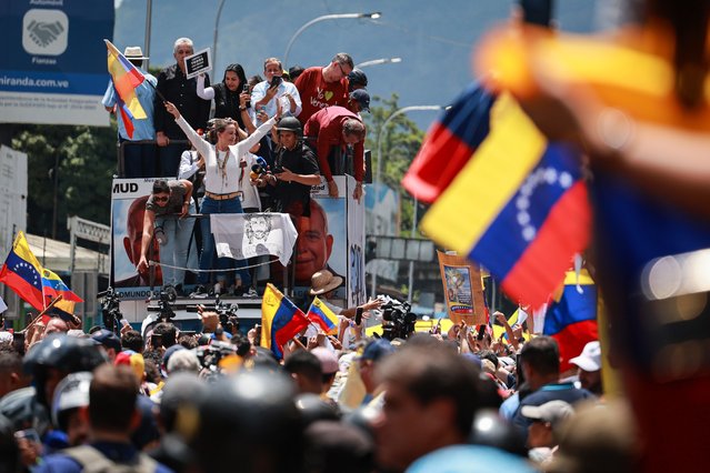 Opposition leader Maria Corina Machado waves a Venezuelan flag during the “Gran Protesta Mundial por la Verdad” opposition protest on August 17, 2024 in Caracas, Venezuela. President of Venezuela Nicolas Maduro was declared as the winner of the 2024 presidential election over his rival, Edmundo Gonzalez. The result has been questioned by the opposition and internationally. According to the opposition leader Maria Corina Machado, the result announced by the 'Consejo Nacional Electoral' (CNE) does not reflect the decision made by the Venezuelans during the election. (Photo by Jesus Vargas/Getty Images)