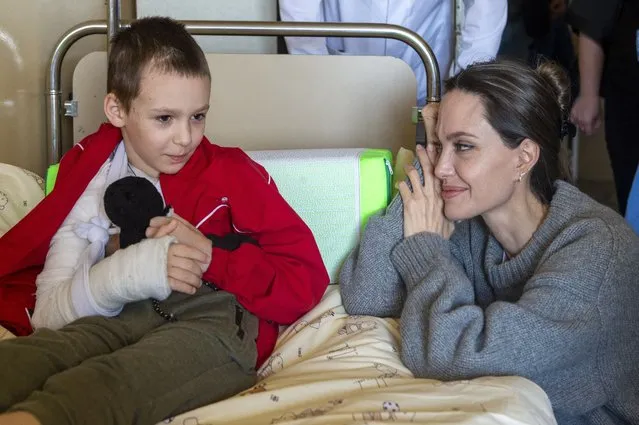 US Actress and UN Goodwill Ambassador Angelina Jolie comforts a young victim of the Kramatorsk railway station missile strike in Lviv children's hospital, in Western Ukraine, 30 April 2022. Actress and UN Goodwill Ambassador Angelina Jolie arrived to Ukraine to support of people amid Russian invasion. Russian troops entered Ukraine on 24 February resulting in fighting and destruction in the country and triggering a series of severe economic sanctions on Russia by Western countries. (Photo by Paul Conroy/EPA/EFE)