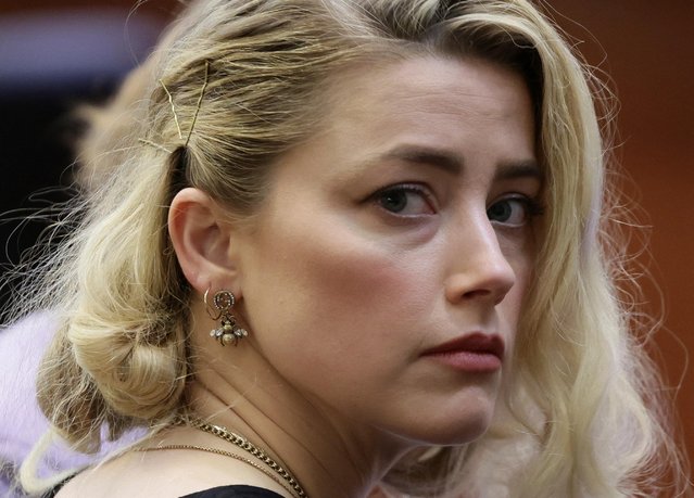 Actor Amber Heard waits before the jury said that they believe she defamed ex-husband Johnny Depp while announcing split verdicts in favor of both her ex-husband Johnny Depp and Heard on their claim and counter-claim in the Depp v. Heard civil defamation trial at the Fairfax County Circuit Courthouse in Fairfax, Virginia, June 1, 2022. (Photo by Evelyn Hockstein/Pool via Reuters)