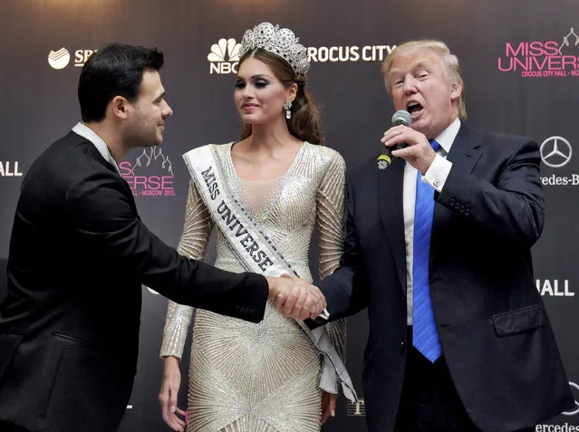 In this file photo taken on Sunday, November 10, 2013, Vice President of Crocus Group Emin Agalarov, left, Miss Universe 2013 Gabriela Isler, from Venezuela, center, and pageant owner Donald Trump, of the United States attend the final of the 2013 Miss Universe pageant in Moscow, Russia. A billionaire real estate mogul, his pop singer son Emin Agalarov, a music promoter, a property lawyer and Russia's prosecutor general are unlikely figures who surfaced in emails released by Donald Trump Jr. as his father's presidential campaign sought potentially damaging information in 2016 from Russia about his opponent, Hillary Clinton. (Photo by Irina Bujor/Kommersant Photo via AP Photo)
