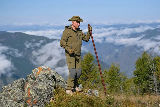In this undated photo released by Russian Presidential Press Service, Russian President Vladimir Putin stands on a hill in Siberia during a break from state affairs ahead of his birthday. Russian president chose the Siberian taiga forest to go on a hike ahead of his birthday on October 7, 2019. (Photo by Alexei Druzhinin/Sputnik/Kremlin Pool Photo via AP Photo)