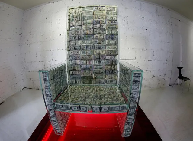 Art object “Money throne x10”, a glass throne filled with $1 million, created by Russian artist Alexey Sergienko and entrepreneur Igor Rybakov, is seen during a presentation in Moscow, Russia on November 29, 2019. (Photo by Tatyana Makeyeva/Reuters)