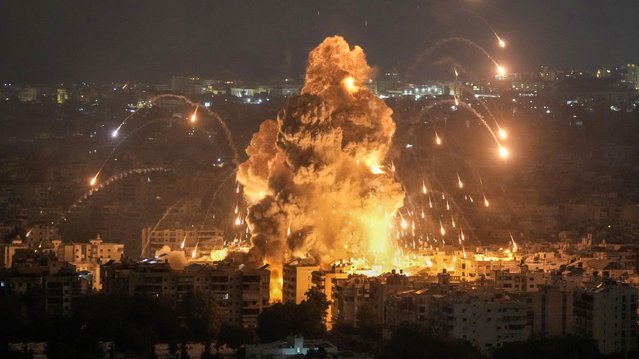 Flames and smoke rise from an Israeli airstrike in Dahiyeh, Beirut, Lebanon, Sunday, October 6, 2024. (Photo by Bilal Hussein/AP Photo)