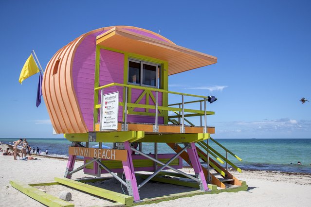 A lifeguard tower, designed by the architect William Lane, is seen in Miami Beach, Florida, USA, 03 August 2022. Lane designed five colorful Miami Beach lifeguard towers in 1995 after Hurricane Andrew, and twenty years later he was invited, by the City of Miami Beach, to design other 36 lifeguard towers now spread across the Miami Beach shoreline. (Photo by Cristobal Herrera-Ulashkevich/EPA/EFE)