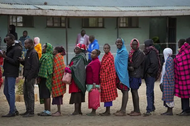 People line up to vote at the Oltepesi Primary School, Kajiado County in Nairobi, Kenya, Tuesday August 9, 2022. (Photo by Ben Curtis/AP Photo)
