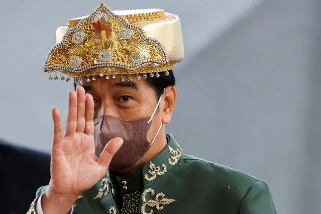 Indonesian President Joko Widodo, wearing traditional attire from Bangka Belitung Islands, waves to journalists as he leaves the parliament building after delivering the annual state of the nation, ahead of the country's Independence Day, in Jakarta, Indonesia on August 16, 2022. (Photo by Willy Kurniawan/Pool via Reuters)