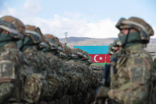 This handout photograph taken and released by Azerbaijani Presidential Press Office on November 8, 2023, shows a military parade in the town of Stepanaker (Khankendi), in Nagorno-Karabakh region. (Photo by Azerbaijani Presidential Press Office/AFP Photo)