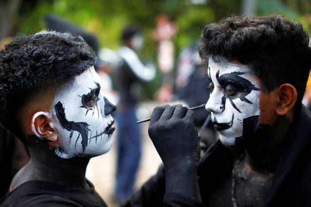 Revellers get ready to take part in a parade known as “La Calabiuza” to celebrate the Day of the Dead in Tonacatepeque, El Salvador on November 4, 2023. (Photo by Jose Cabezas/Reuters)