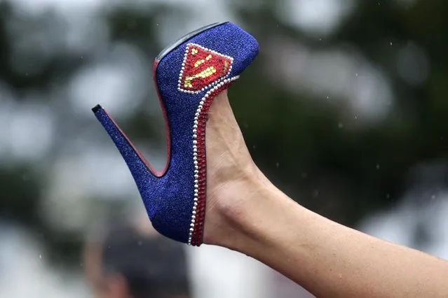 Miss Illinois Marisa Buchheit displays her shoe during the Miss America Shoe Parade at the Atlantic City boardwalk, Saturday, September 13, 2014, in Atlantic City, N.J. (Photo by Julio Cortez/AP Photo)