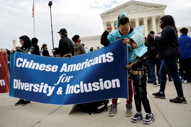 OiYan Poon and her daughter Te Te, 7, join demonstrators ahead of arguments before the U.S. Supreme Court in cases dealing with race and affirmative action in university admissions, at the Supreme Court building in Washington, U.S. October 31, 2022. (Photo by Jonathan Ernst/Reuters)