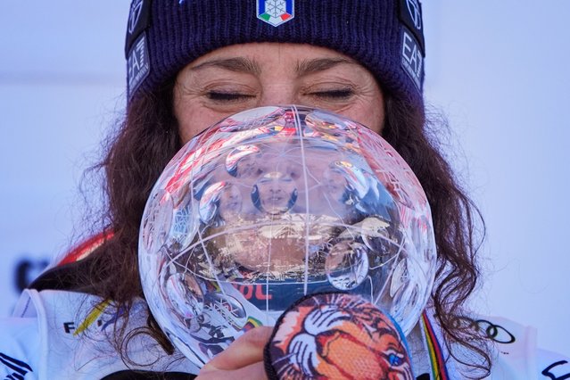 Italy's Federica Brignone is reflected in the crystal globe trophy after winning the women's giant slalom season championship at the World Cup Finals, Tuesday, March 25, 2025, in Sun Valley, Idaho. (Photo by John Locher/AP Photo)