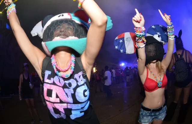 A crowd dances to electronic beats at the TomorrowWorld electronic music festival in Chattahoochee Hills, South of Atlanta, on Saturday, September 27, 2014. The event has been the world's most popular electronic music festival in Europe for years. It takes about three weeks to transform the 350-acres of farm land at Bouckaert Farm in Chattahoochee Hills into the self-contained EDM haven known as TomorrowWorld. (Photo by Hyosub Shin/AJC)