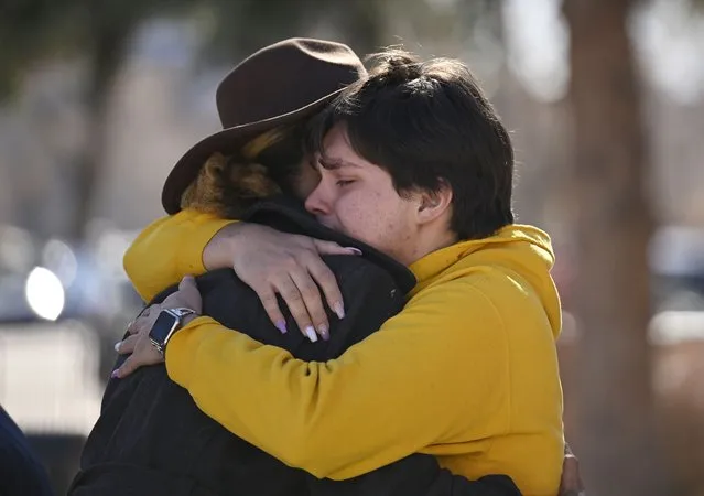 Leia-jhene Seals, left, hugs Carter Rodriguez outside All Souls Unitarian Church before a vigil for the victims of an overnight fatal shooting at Club Q, an LGBTQ nightclub, Sunday, November 20, 2022, in Colorado Springs, Colo. (Photo by R.J. Sangosti/The Denver Post via AP Photo)