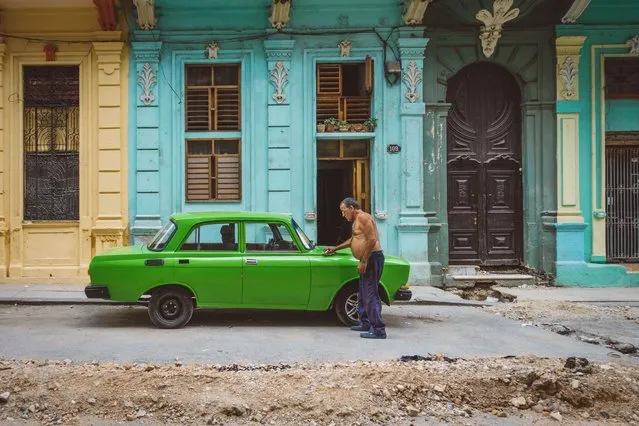 A green Soviet vintage car on the colourful streets of Central Havana (Centro Habana), Cuba, July 2016. (Photo by Bobi Dojcinovski/REX Shutterstock)