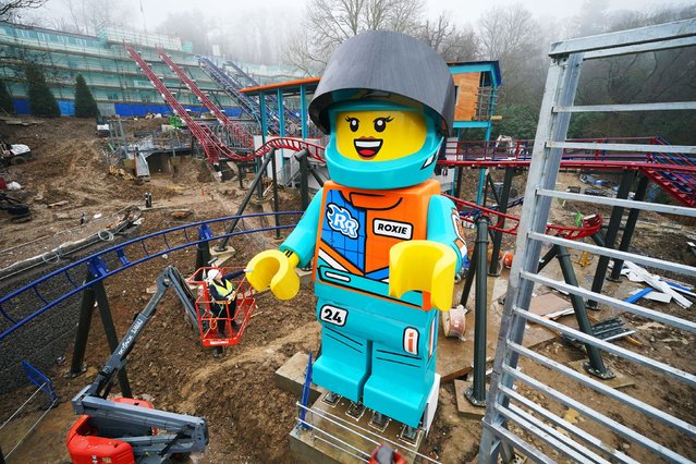 Lead Creative Hannah “Phiz” Phizacklea tends to the world's tallest Lego minifigure, Roxie, at Legoland Windsor Resort, in Berkshire, UK on Thursday February 8, 2024, ahead of the launch of the Minifigure Speedway duelling coaster, which will open to the public in March at the brand-new Legoland accommodation site, Woodland Village. (Photo by Jonathan Brady/PA Images via Getty Images)
