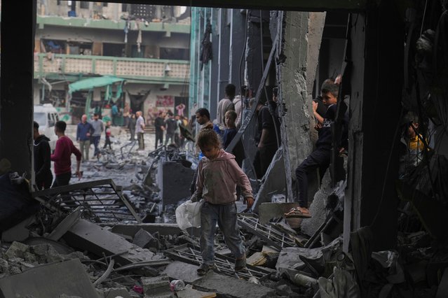 Palestinians inspect the damage at a U.N. school used as a shelter by displaced residents that was hit by Israeli military strikes, killing more than 15 people, in Jabaliya, northern Gaza Strip, on Monday, May 12, 2025. (Photo by Jehad Alshrafi/AP Photo)