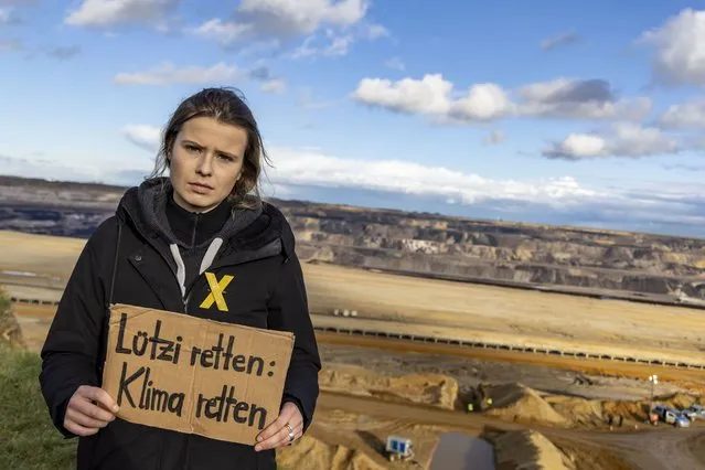 Luisa Neubauer, climate activist, on the edge of the quarry at the Garzweiler II open pit mine in Luetzerath, Germany, Sunday, January 8, 2023. Luetzerath is to be mined for the expansion of the Garzweiler II opencast lignite mine. (Photo by Henning Kaiser/dpa via AP Photo)
