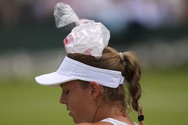 Veronika Erjavec of Slovenia uses an ice bag during her first round women's singles match against Marta Kostyuk of Ukraine at the Wimbledon Tennis Championships in London, Tuesday, July 1, 2025. (Photo by Kirsty Wigglesworth/AP Photo)