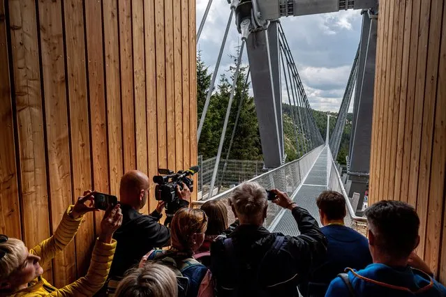 A view of the newly completed world's longest suspension bridge, the “Sky Bridge 721”, in Dolni Morava, Czech Republic, 09 May 2022. The structure connecting the ridges of two mountain peaks is 721 meters long and rises 95 meters above the valley. The facility will be officially opened on 13 May 2022. (Photo by Maciej Kulczynski/EPA/EFE)