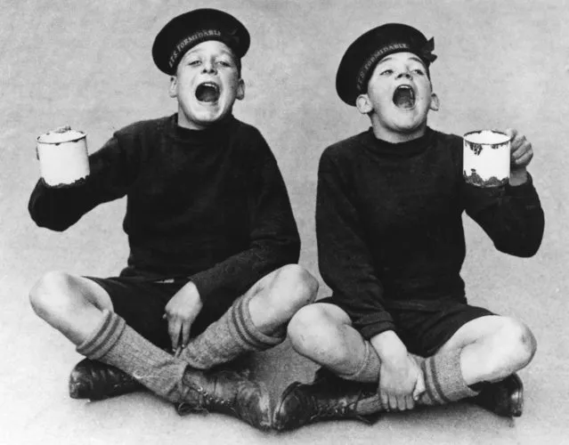 Two young cadets at the Royal Nautical School, Portishead, Somerset, gargling as a preventative measure against an influenza epidemic, 22nd October 1934. (Photo by Fox Photos/Getty Images)