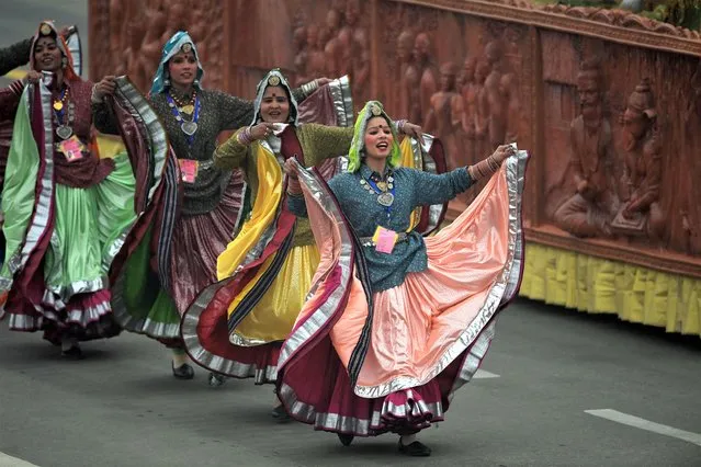 Dancers in traditional attires perform during India's 74th Republic Day parade in New Delhi on January 26, 2023. (Photo by Money Sharma/AFP Photo)