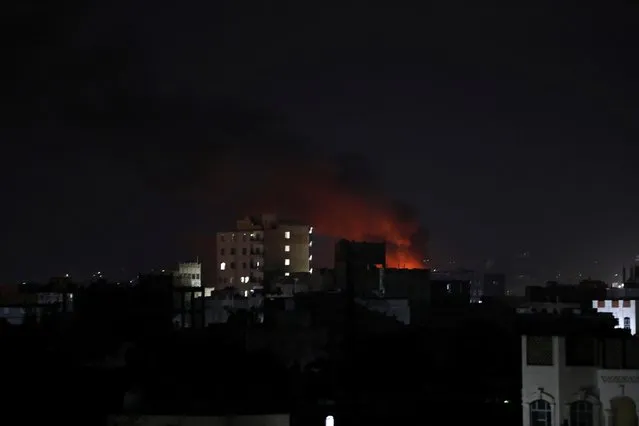 Fire is seen at the site of Saudi-led air strikes in Sanaa, Yemen on September 13, 2020. (Photo by Khaled Abdullah/Reuters)