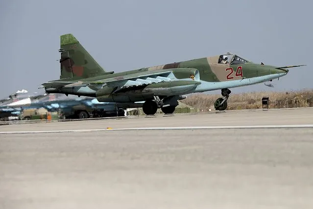 A Sukhoi Su-25 fighter jet taxis on the tarmac at the Hmeymim air base near Latakia, Syria, in this handout photograph released by Russia's Defence Ministry October 22, 2015. (Photo by Reuters/Ministry of Defence of the Russian Federation)