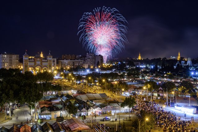 Fireworks light up the sky of Seville during the closing events of the April Fair in Sevilla, southern Spain, 20 April 2024. (Photo by Raul Caro/EPA)