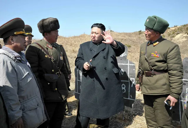 Kim Jong Un inspects the second battalion under the Korean People's Army Unit 1973, honored with the title of “O Jung Hup-led 7th Regiment”, on March 23, 2013, in this picture released on March 24, 2013. (Photo by Reuters/KCNA)