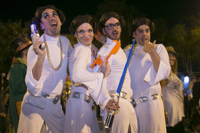 A group of men dressed as Star Wars character Princess Leia pose at the West Hollywood Halloween Costume Carnaval, which attracts nearly 500,000 people annually, in West Hollywood, California October 31, 2015. (Photo by Jonathan Alcorn/Reuters)