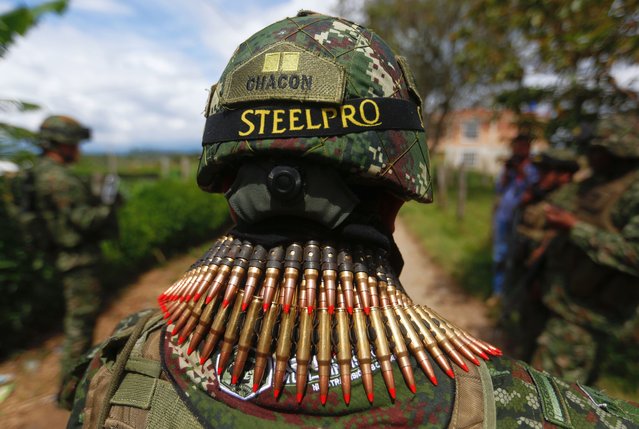 A Colombian soldier patrols near the police station that was attacked by dissidents of the Revolutionary Armed Forces of Colombia (FARC) in Morales, Colombia, 20 May 2024. The victims of the attack perpetrated by alleged dissidents of FARC are four citizens, according to a new report by Colombian Defense Minister Ivan Velasquez. (Photo by Ernesto Guzmán Jr./EPA/EFE)