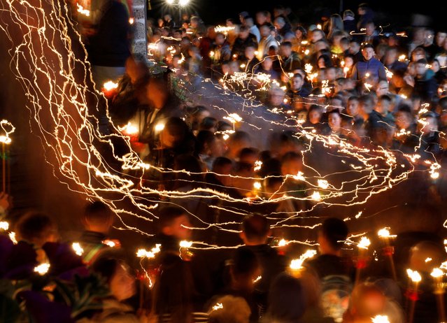 People attend Orthodox Easter service at St. John the Baptist Monastery, near Mavrovo, North Macedonia on May 5, 2024. (Photo by Ognen Teofilovski/Reuters)
